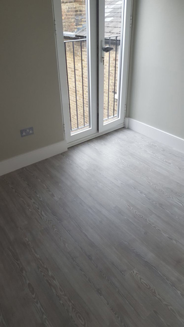 portfolio smooth floors amtico grey wood effect bathroom and bedroom 02